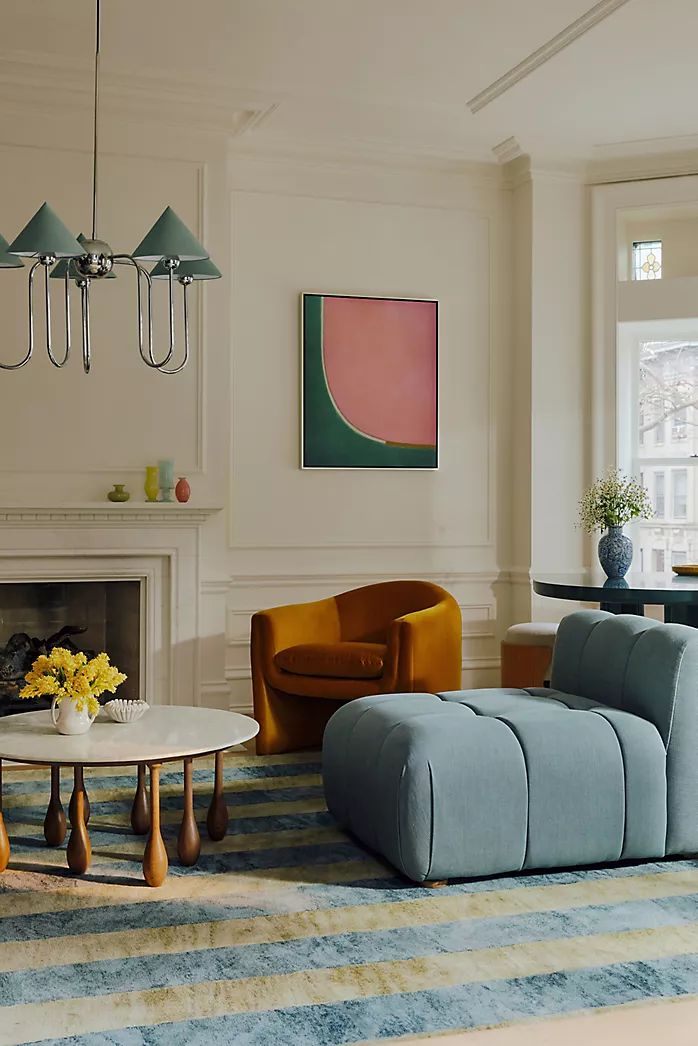 Living room with a tan armchair and marble table