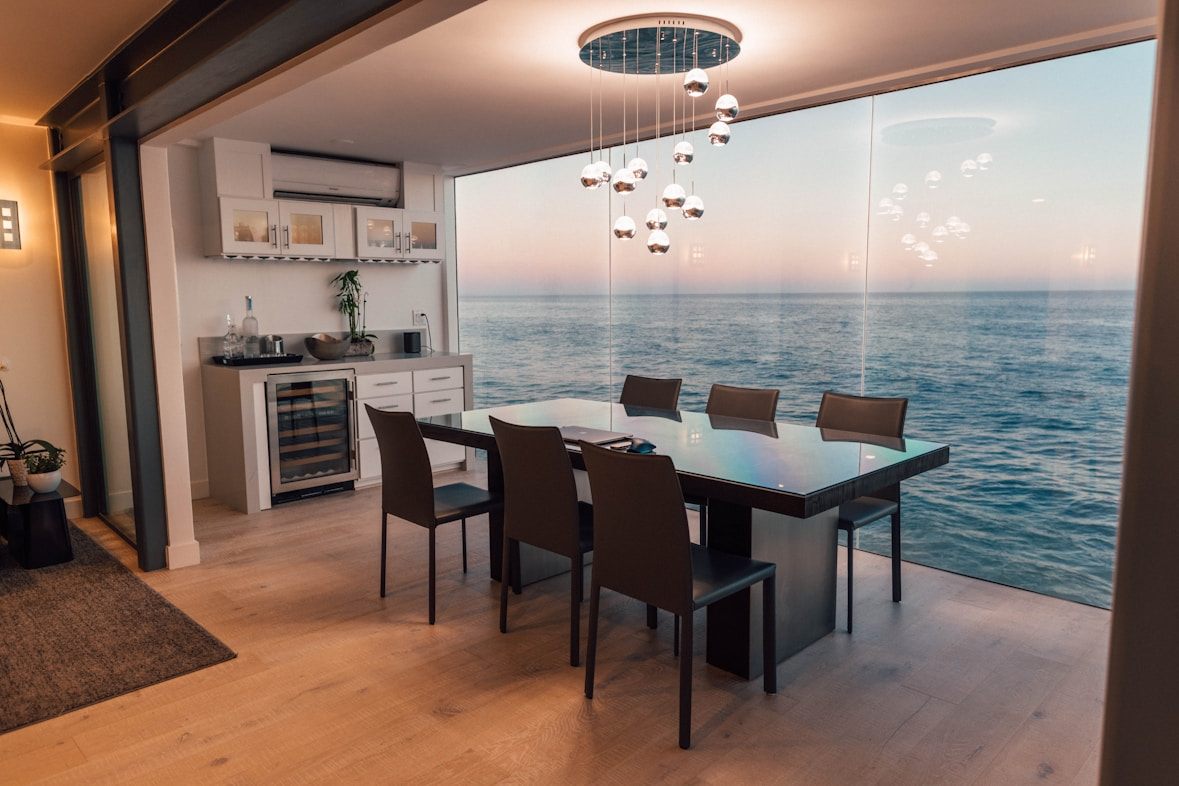 Dining room opening to a sea view